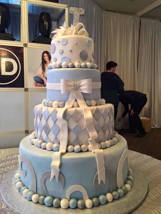 4-tiered light blue and white cake
