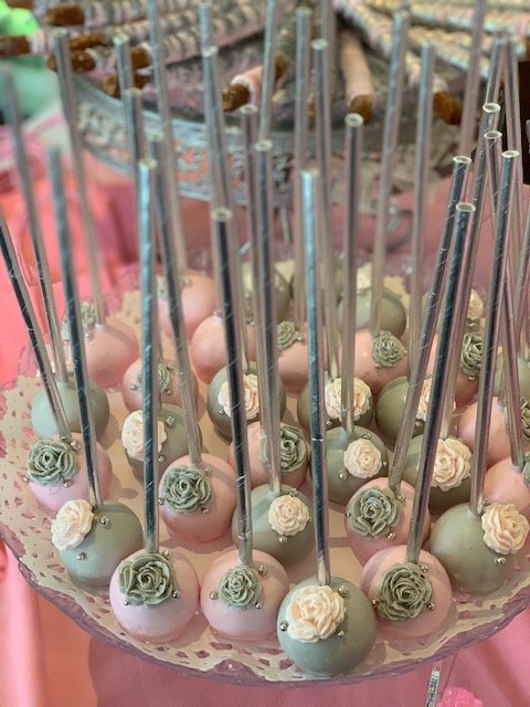 Pink and Green Cake Pops with flowers on them