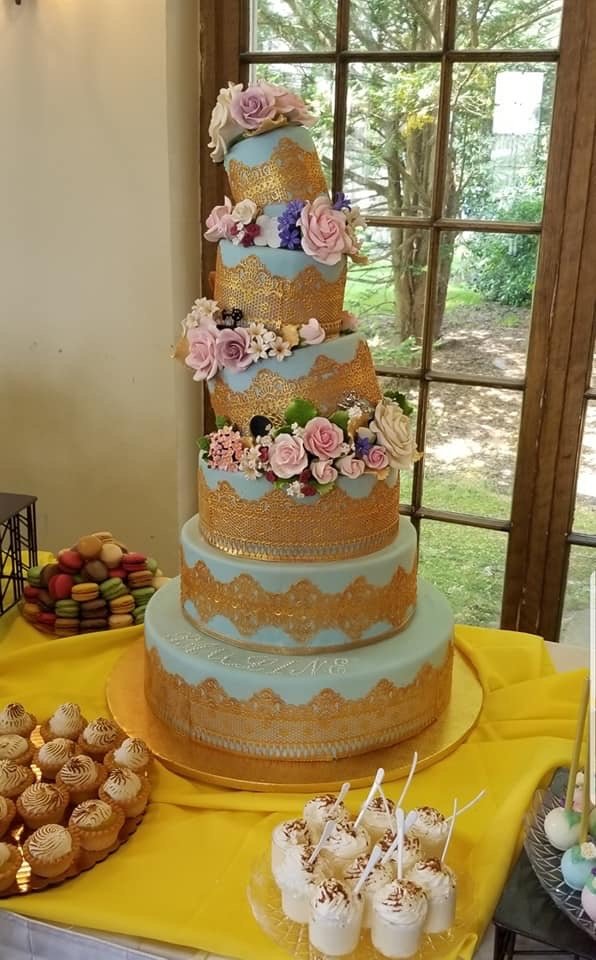 6-tiered lopsided cake - gold and light blue