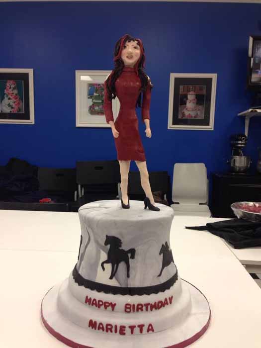 Horse cake with woman on top