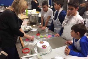 4 boys watching a woman leading a class | Cake Decorating Decorating Tools Brentwood