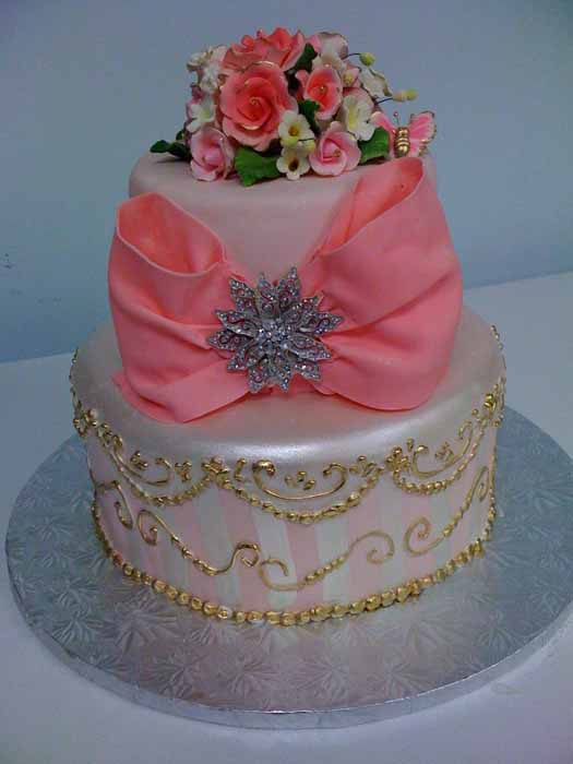 two tiered cake with pink bow