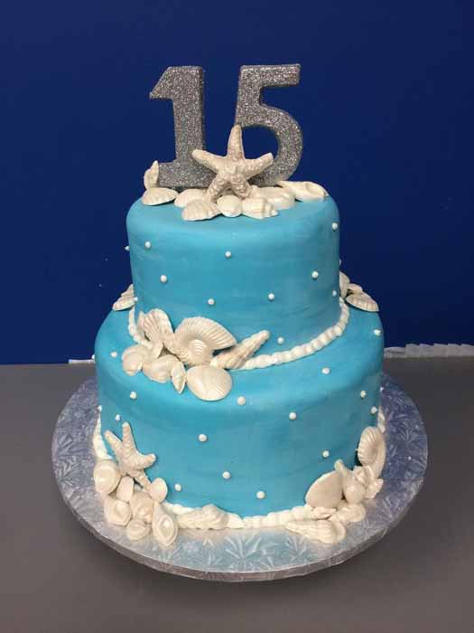Seashell cake with 15 topper